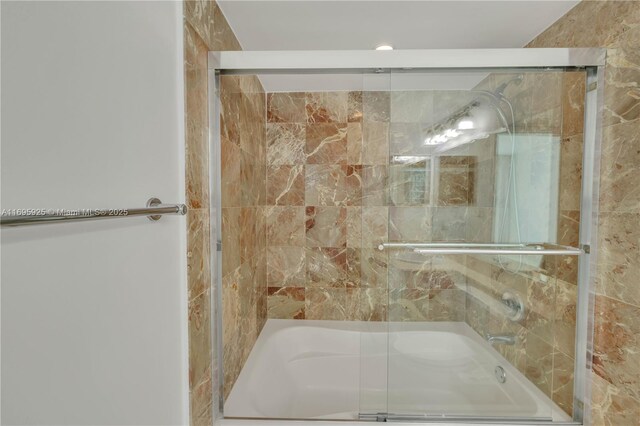 bathroom featuring enclosed tub / shower combo