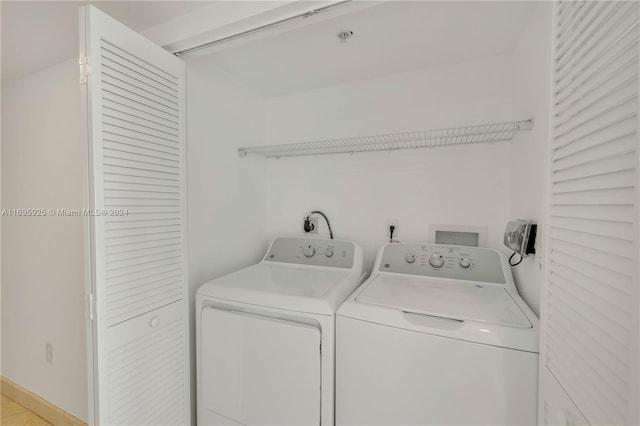 clothes washing area featuring washing machine and dryer