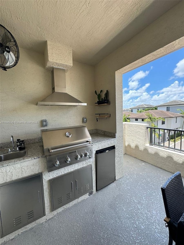 view of patio featuring a grill and sink