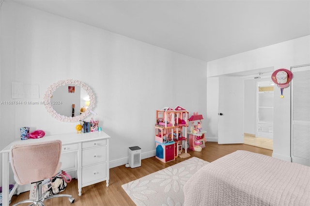 bedroom with light hardwood / wood-style flooring