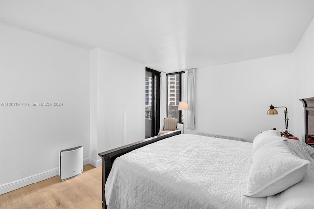 bedroom with light hardwood / wood-style floors