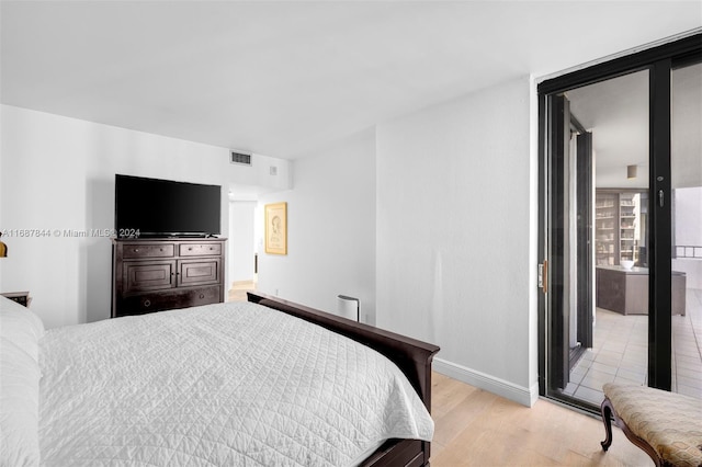 bedroom with light hardwood / wood-style flooring