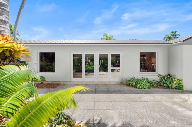 back of house featuring a patio area and french doors