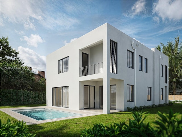 rear view of property featuring a fenced in pool, a patio area, and a lawn