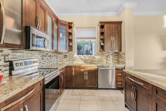 kitchen with appliances with stainless steel finishes, light stone counters, and ornamental molding