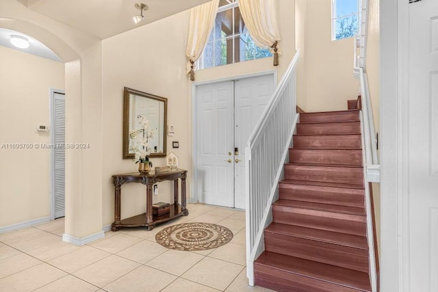 entrance foyer with light tile patterned floors