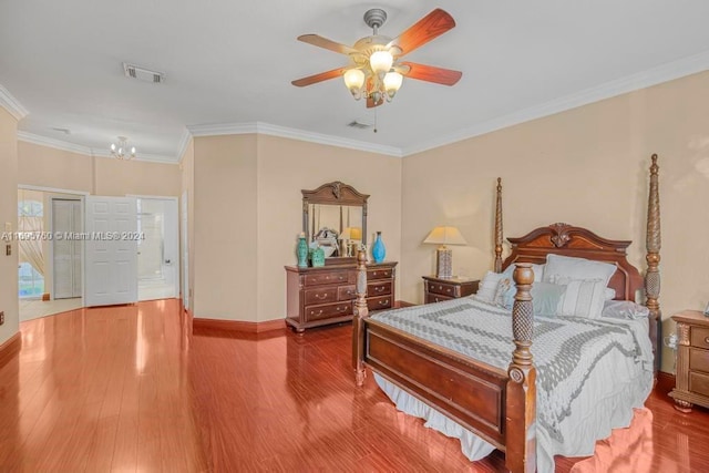 bedroom featuring hardwood / wood-style floors, ceiling fan, and crown molding