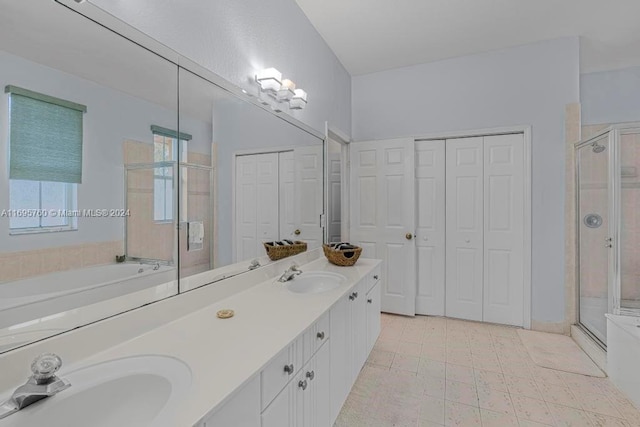 bathroom featuring vanity and separate shower and tub