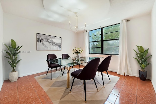 tiled dining area with an inviting chandelier