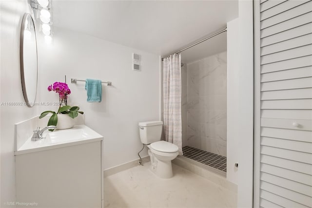 bathroom featuring curtained shower, vanity, and toilet