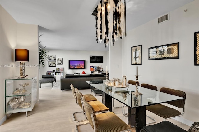 dining space featuring light hardwood / wood-style floors