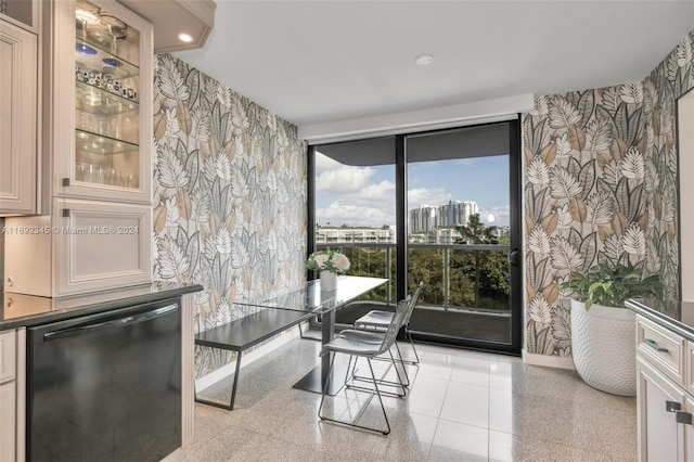 dining space featuring a wall of windows