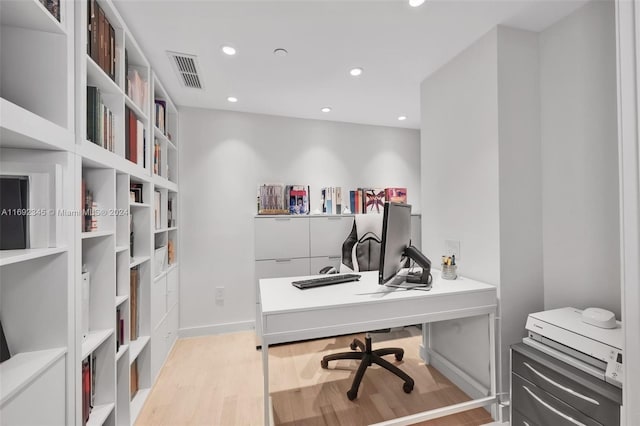 office space with light hardwood / wood-style floors