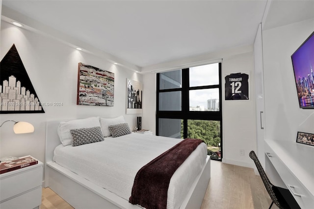 bedroom featuring light wood-type flooring