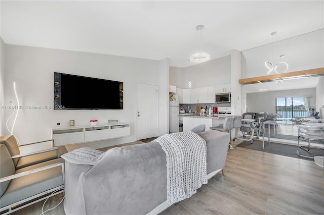 468 NE 206th Ln Unit 206, Miami, FL 33179 - living room with light wood finished floors and a high ceiling