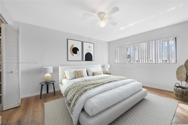 468 NE 206th Ln Unit 206, Miami, FL 33179 - bedroom featuring wood finished floors, a ceiling fan, a closet, and baseboards