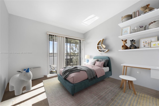 468 NE 206th Ln Unit 206, Miami, FL 33179 - bedroom with access to outside, lofted ceiling, and wood finished floors