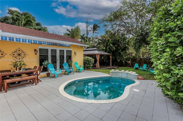 view of swimming pool featuring a gazebo and a patio area