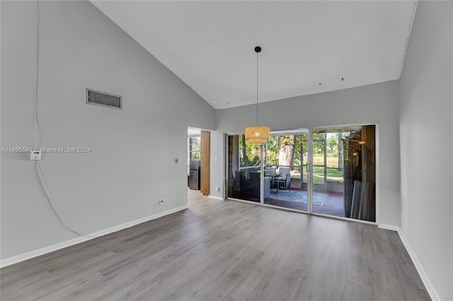7243 W Sunrise Blvd Unit 7243K, Plantation, FL 33313 - spare room with high vaulted ceiling and wood finished floors