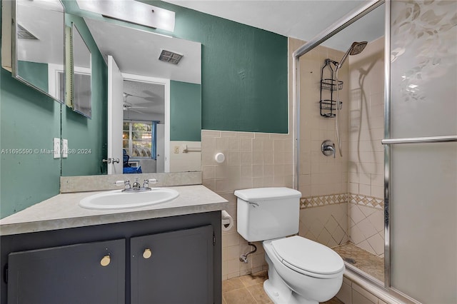 7243 W Sunrise Blvd Unit 7243K, Plantation, FL 33313 - full bath with a stall shower, tile walls, vanity, tile patterned flooring, and a wainscoted wall