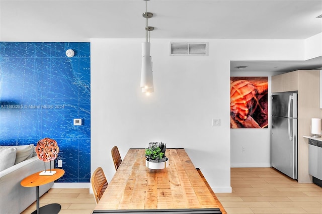 dining room featuring tile walls