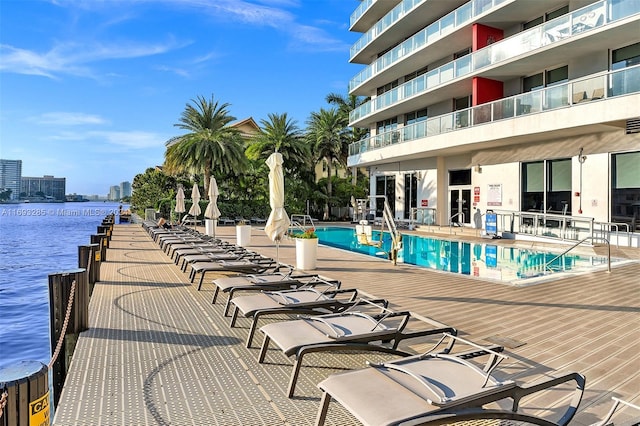 view of pool with a water view