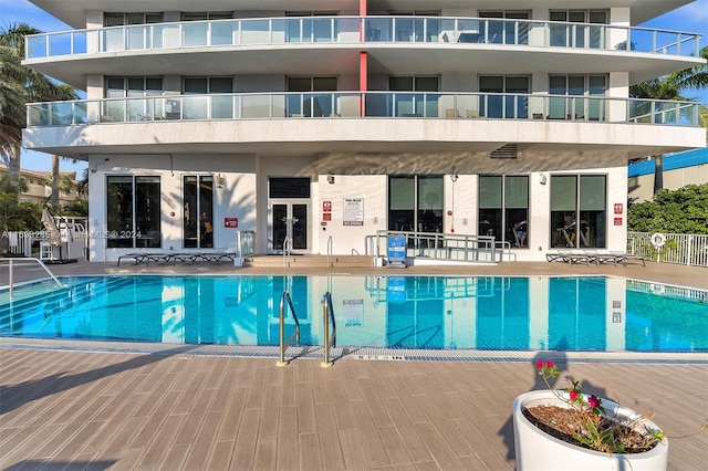 view of pool featuring a patio area and french doors