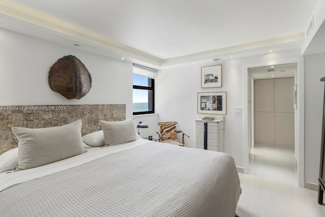 bedroom featuring light tile patterned flooring