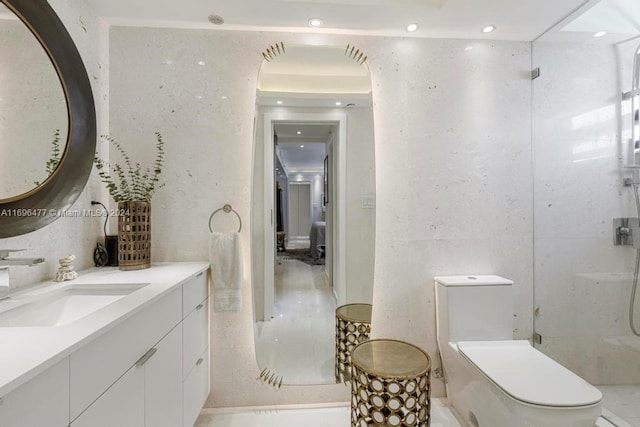 bathroom featuring a shower, vanity, and toilet