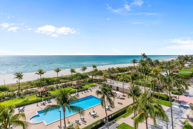 bird's eye view with a view of the beach and a water view