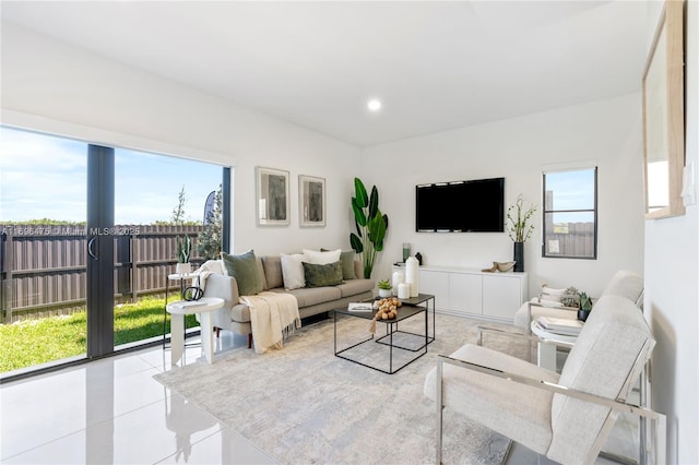 living room with tile patterned floors and recessed lighting