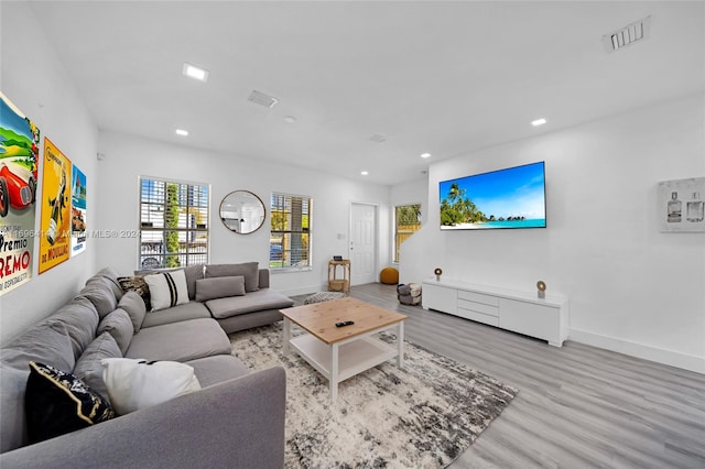 living room with light hardwood / wood-style flooring