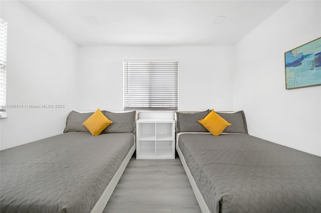 bedroom featuring wood-type flooring