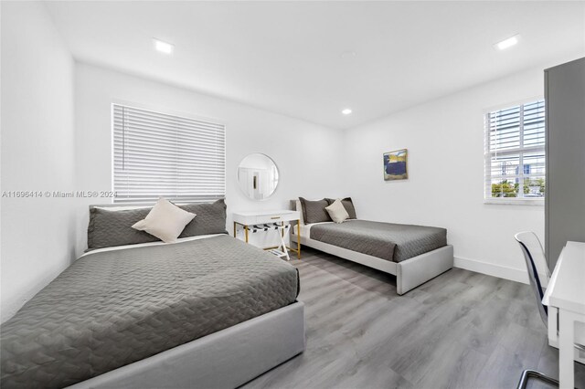 bedroom with light hardwood / wood-style flooring