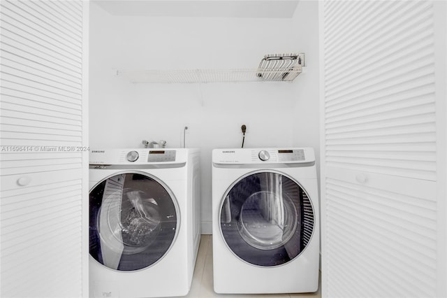 laundry area with independent washer and dryer