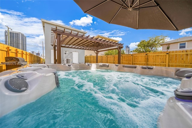 view of pool with a pergola and a hot tub