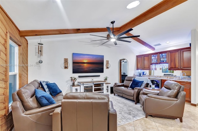 tiled living room featuring wine cooler, ceiling fan, and lofted ceiling with beams