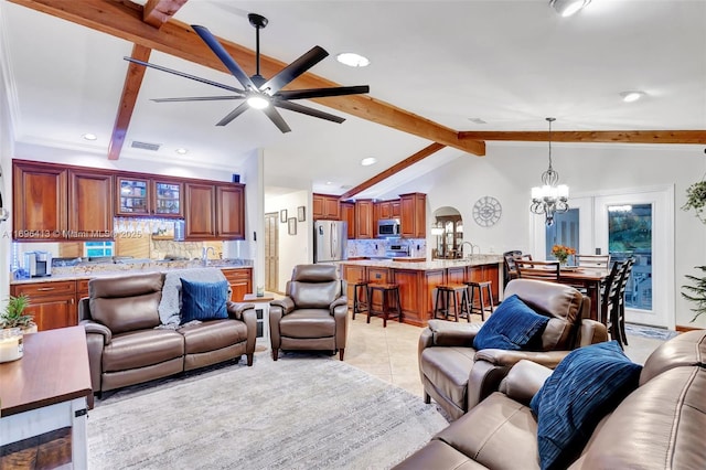 tiled living room featuring sink, vaulted ceiling with beams, and ceiling fan with notable chandelier