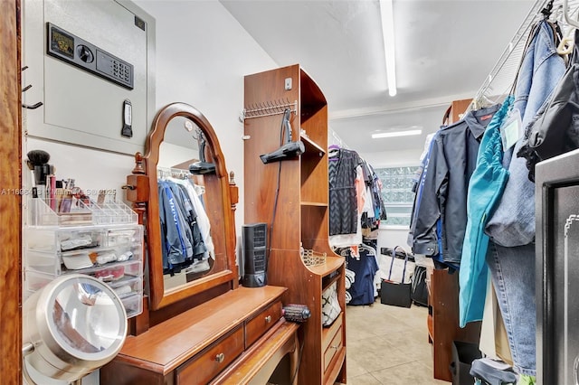 walk in closet featuring light tile patterned flooring