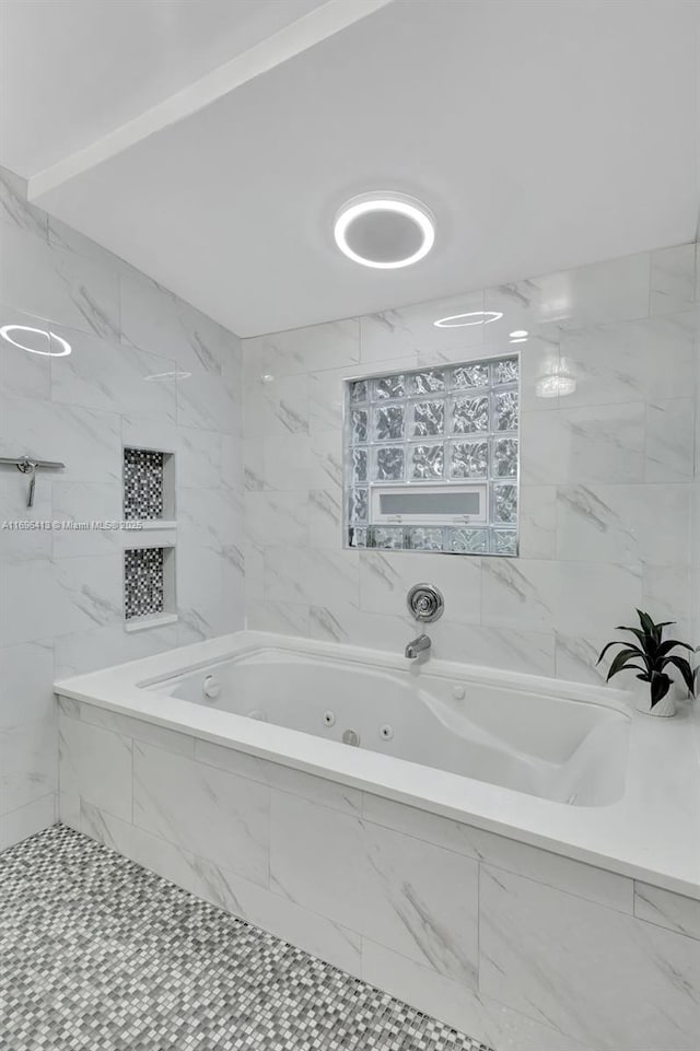 bathroom featuring tiled bath