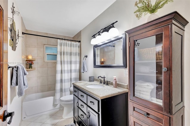 full bathroom featuring vanity, toilet, tile patterned flooring, and shower / bath combo with shower curtain