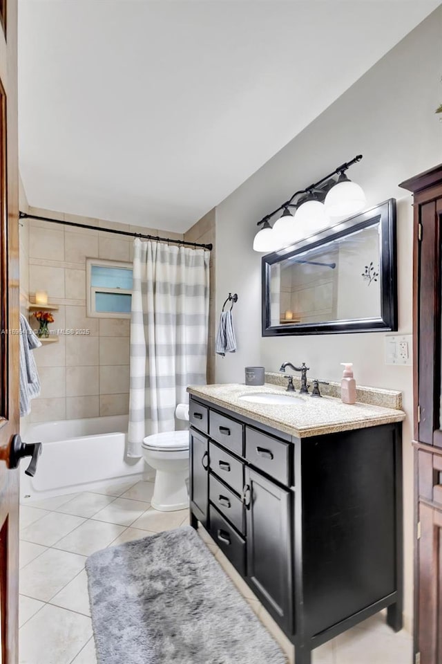 full bathroom featuring vanity, tile patterned floors, toilet, and shower / bath combo