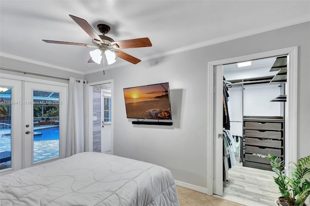 tiled bedroom with french doors, crown molding, access to outside, a closet, and ceiling fan