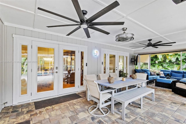 sunroom featuring french doors and ceiling fan