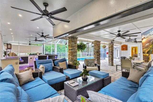 view of patio with ceiling fan, an outdoor hangout area, and a lanai