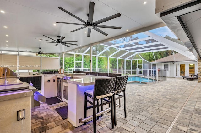 view of patio with an outdoor kitchen and exterior bar