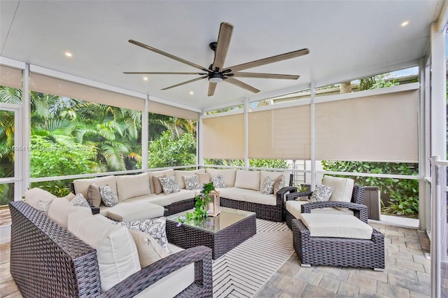 sunroom featuring plenty of natural light and ceiling fan