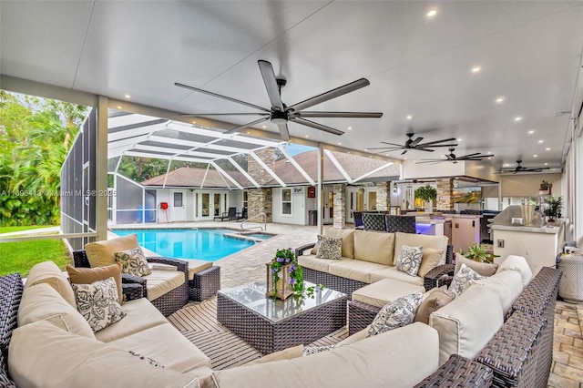 view of swimming pool featuring area for grilling, a lanai, a patio area, and outdoor lounge area