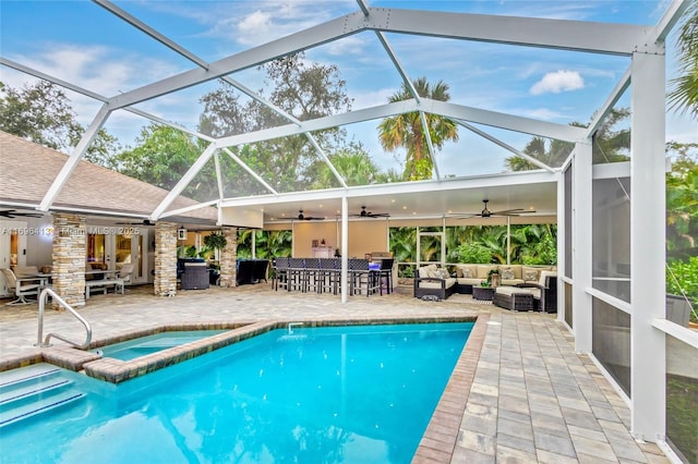 view of swimming pool with outdoor lounge area, an outdoor bar, ceiling fan, and a patio area