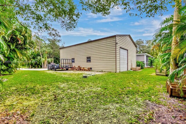 exterior space with an outbuilding and a yard